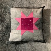 Wonky Star pillow on top of back of Offset Gradients quilt